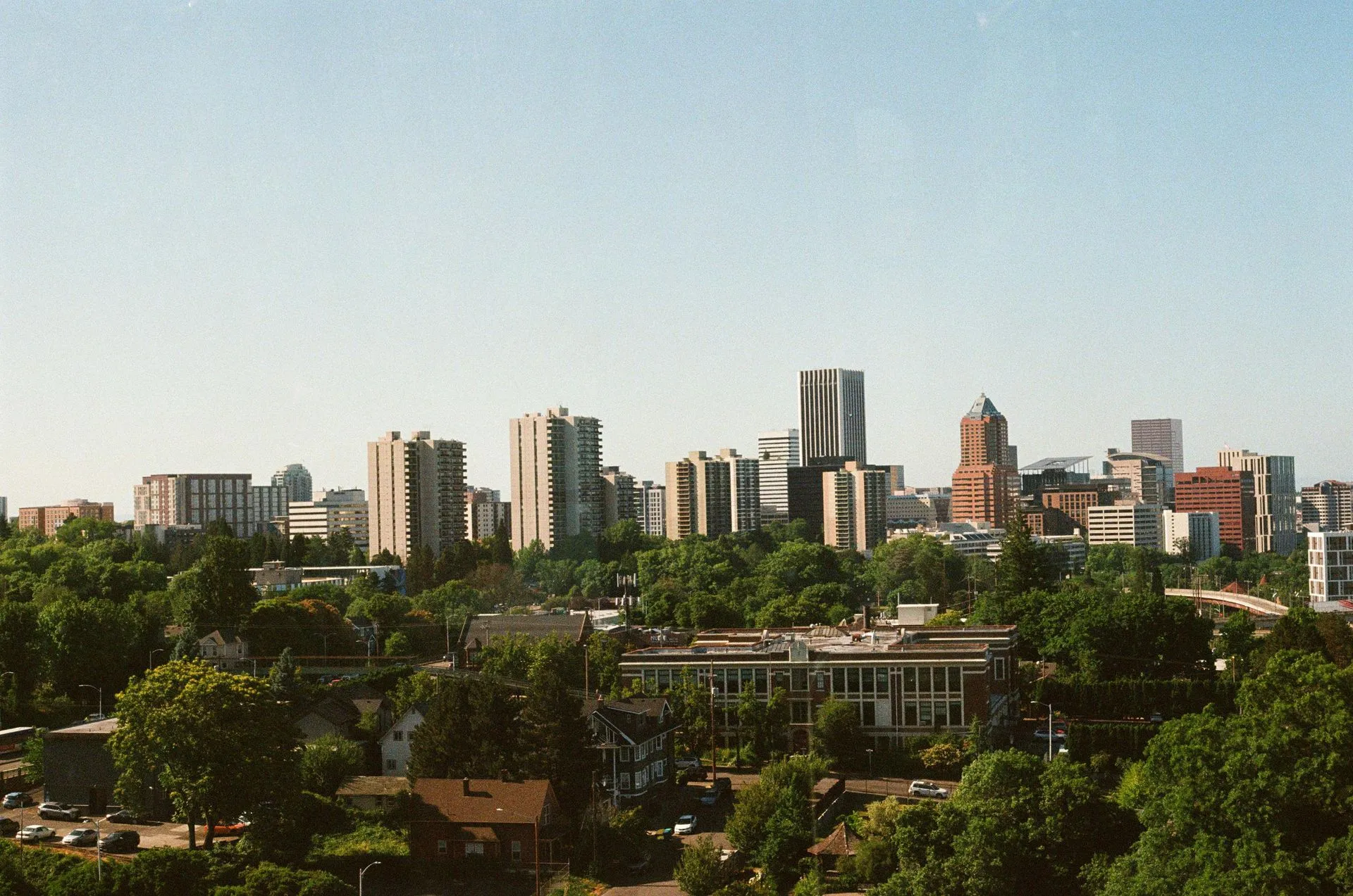The skyline of New Jersey is reflected in a lake.