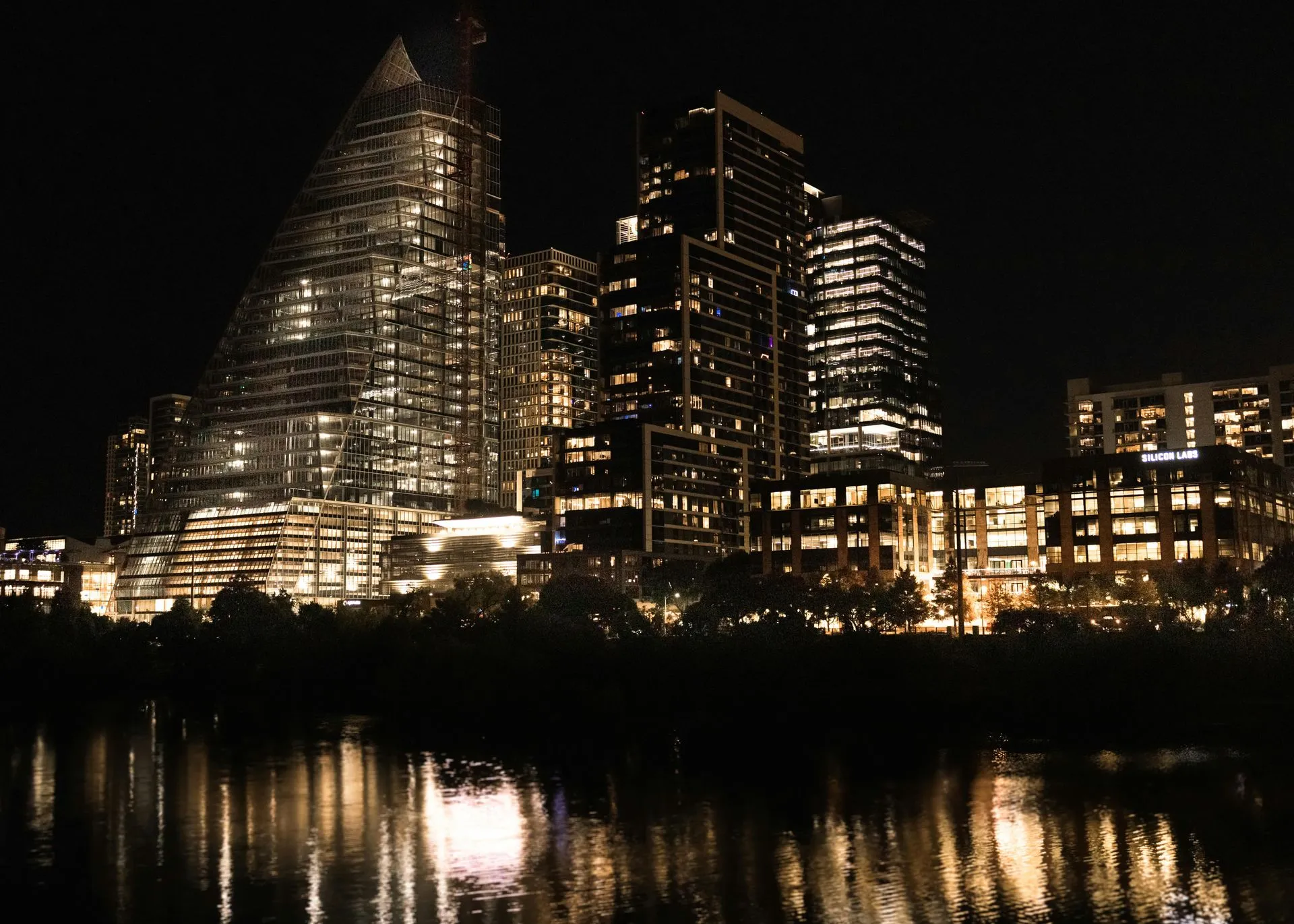 The skyline of New Jersey is reflected in a lake. The skyline of New Jersey is reflected in a lake.