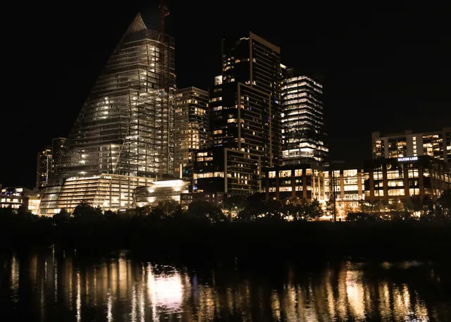 The skyline of New Jersey is reflected in a lake. The skyline of New Jersey is reflected in a lake.