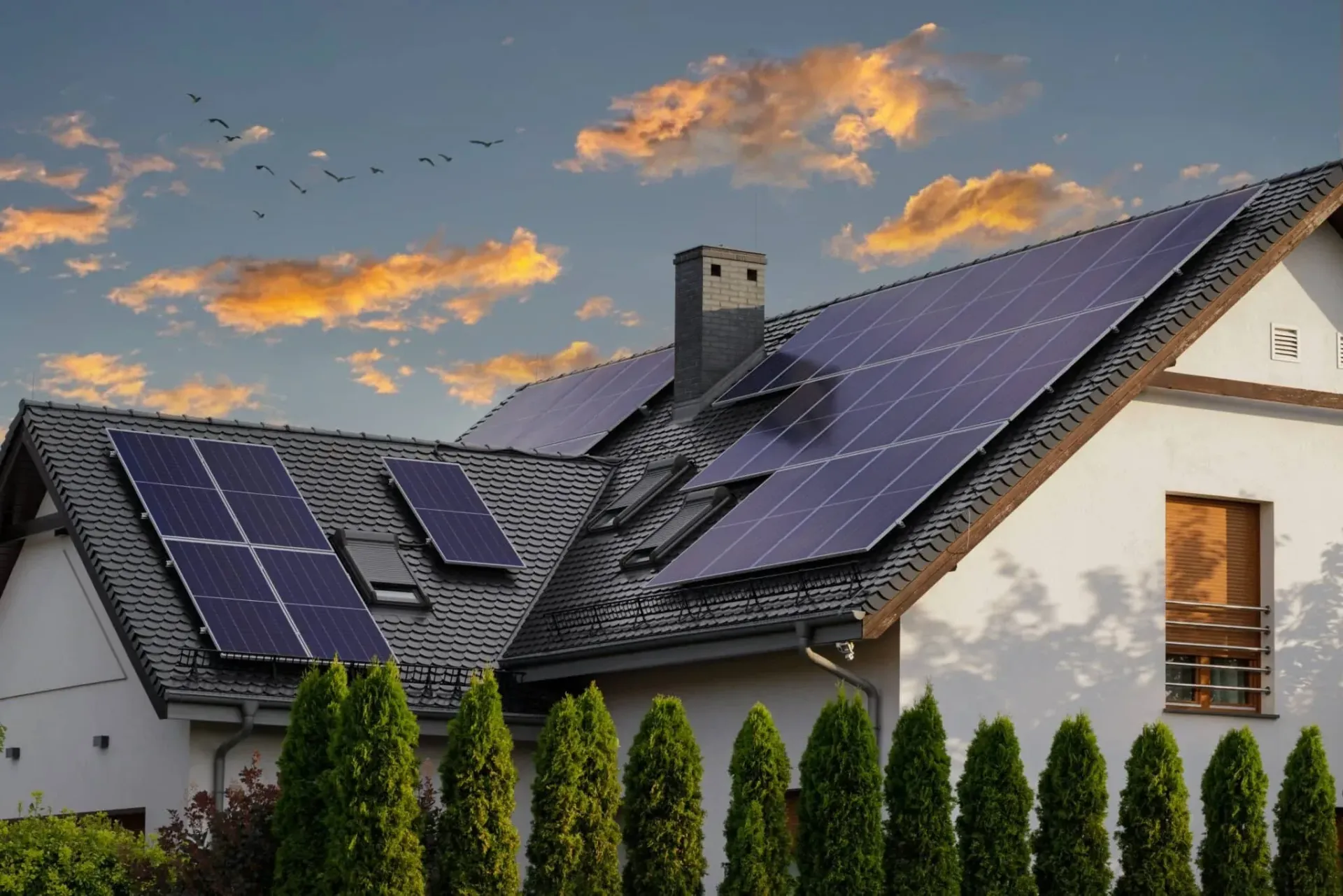 A house with a lot of solar panels on the roof